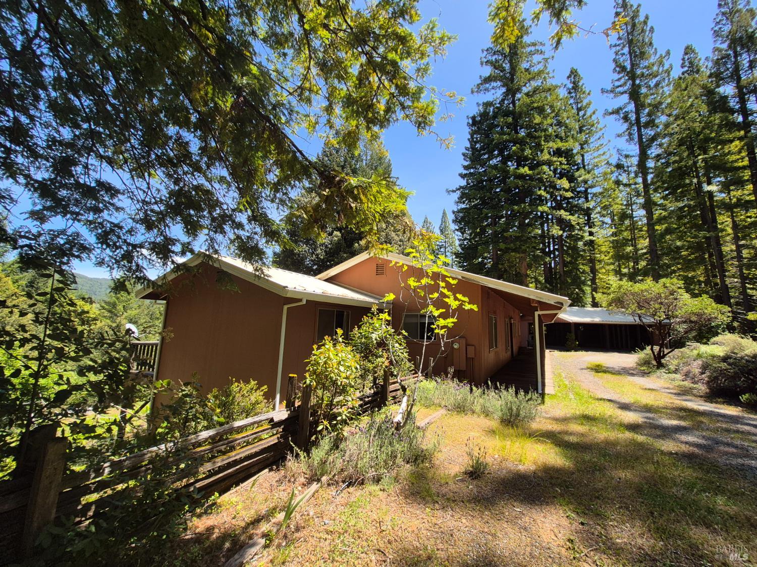 11903 Branscomb Road Laytonville, CA 95454 - Photo 44 of 72 a backyard of a house with lots of green space