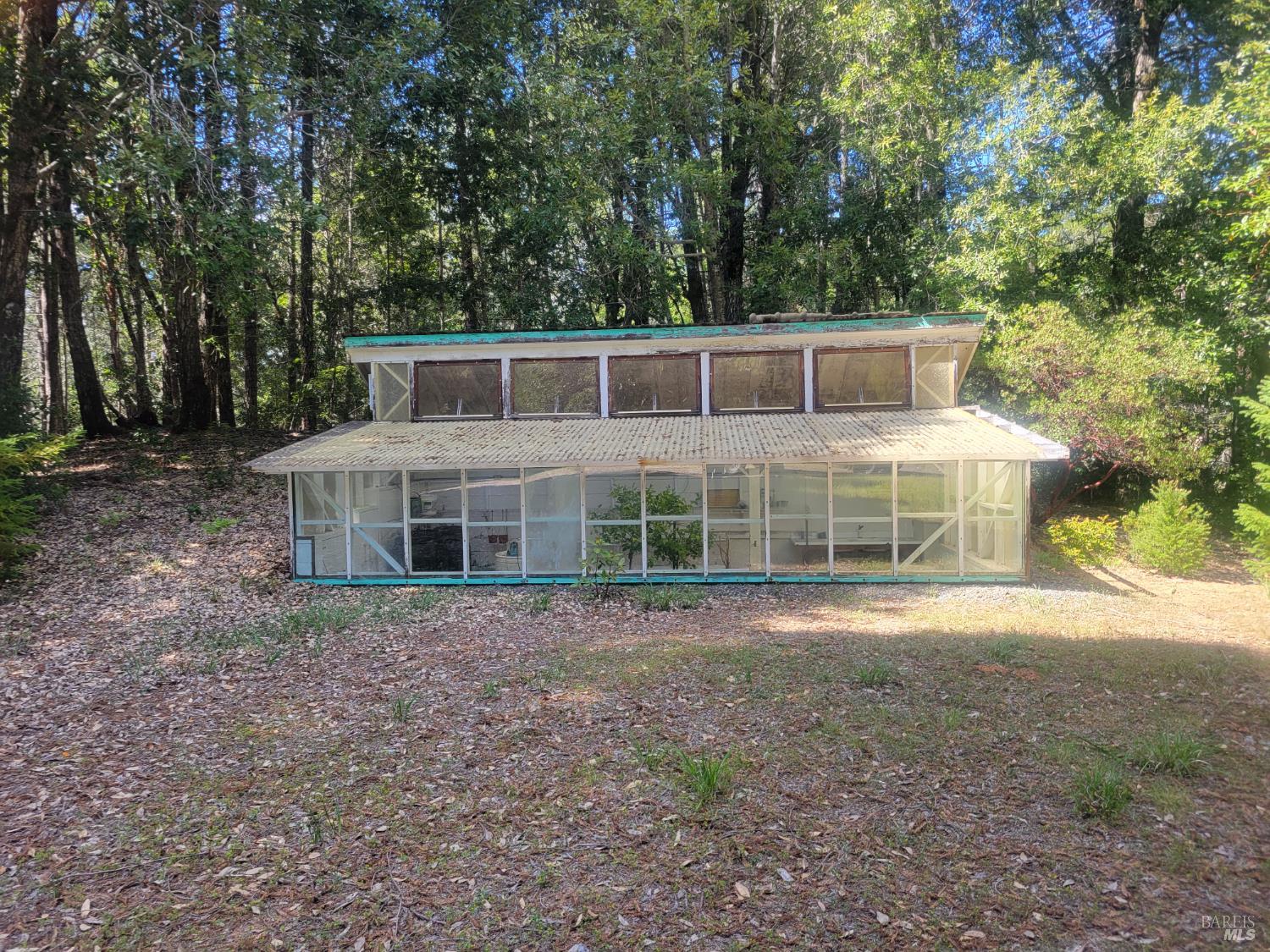 11903 Branscomb Road Laytonville, CA 95454 - Photo 10 of 72 a front view of a house with a garden