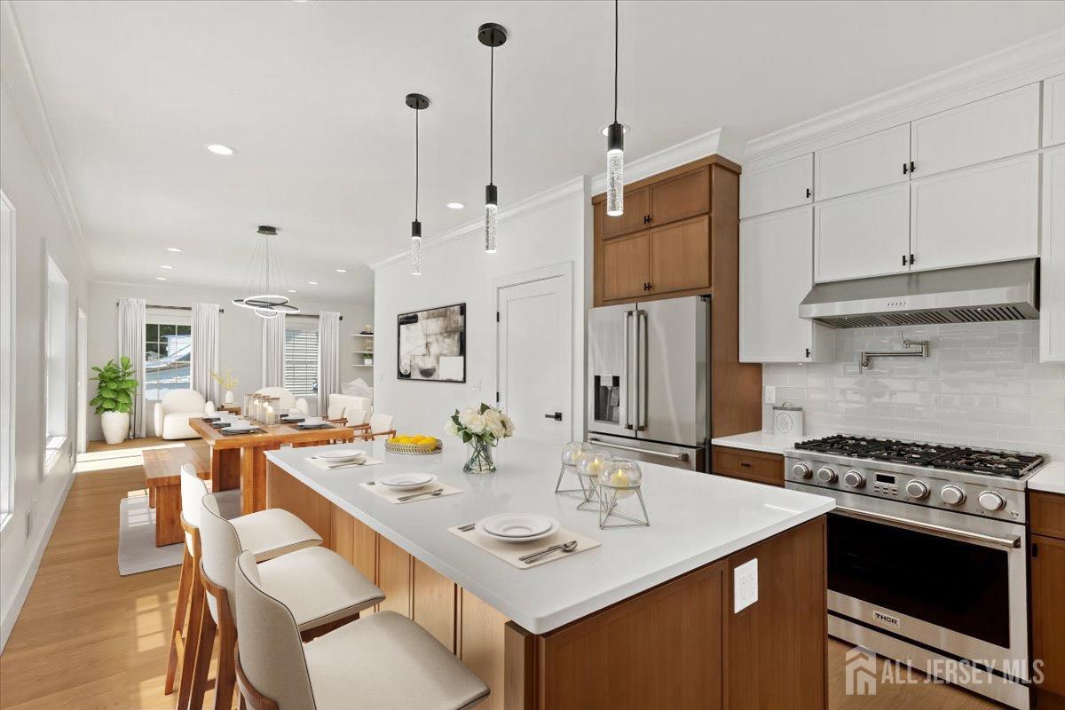 30 Ashley Road Edison, NJ 08817 - Photo 11 of 39 a kitchen with stainless steel appliances granite countertop a sink stove and refrigerator