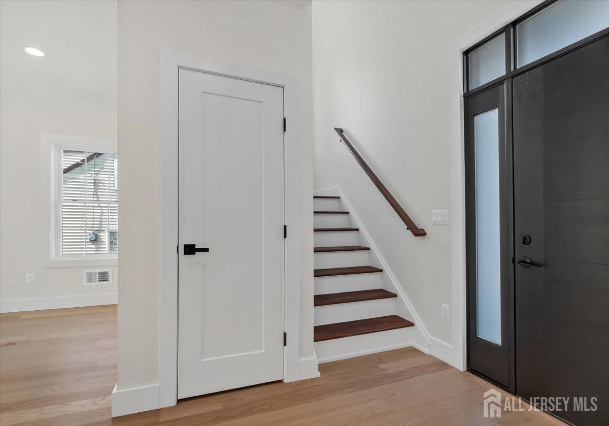 30 Ashley Road Edison, NJ 08817 - Photo 13 of 39 a view of a hallway with wooden floor and entryway