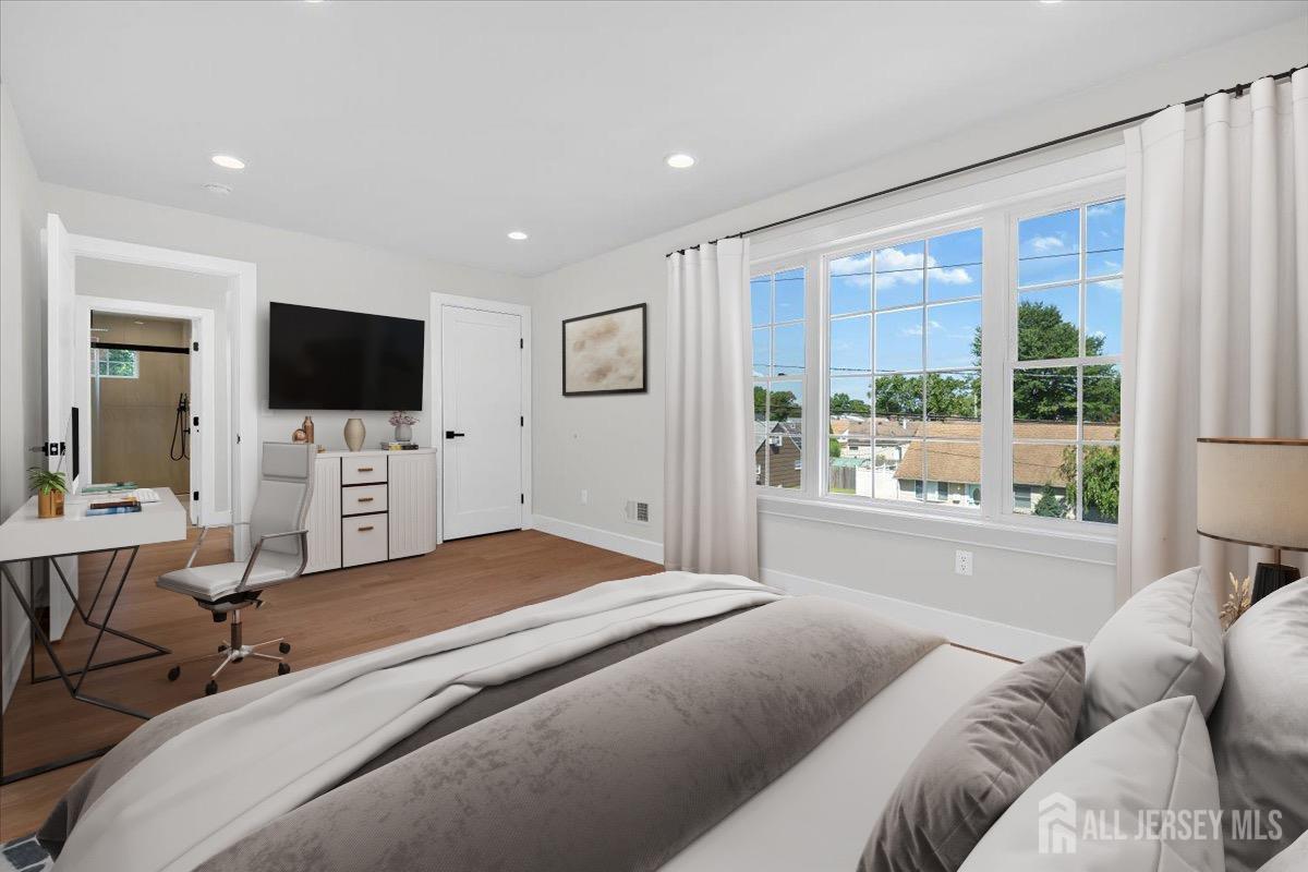 30 Ashley Road Edison, NJ 08817 - Photo 15 of 39 a bedroom with a bed and a flat screen tv