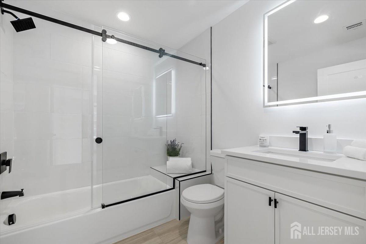 30 Ashley Road Edison, NJ 08817 - Photo 27 of 39 a bathroom with a granite countertop sink toilet and shower