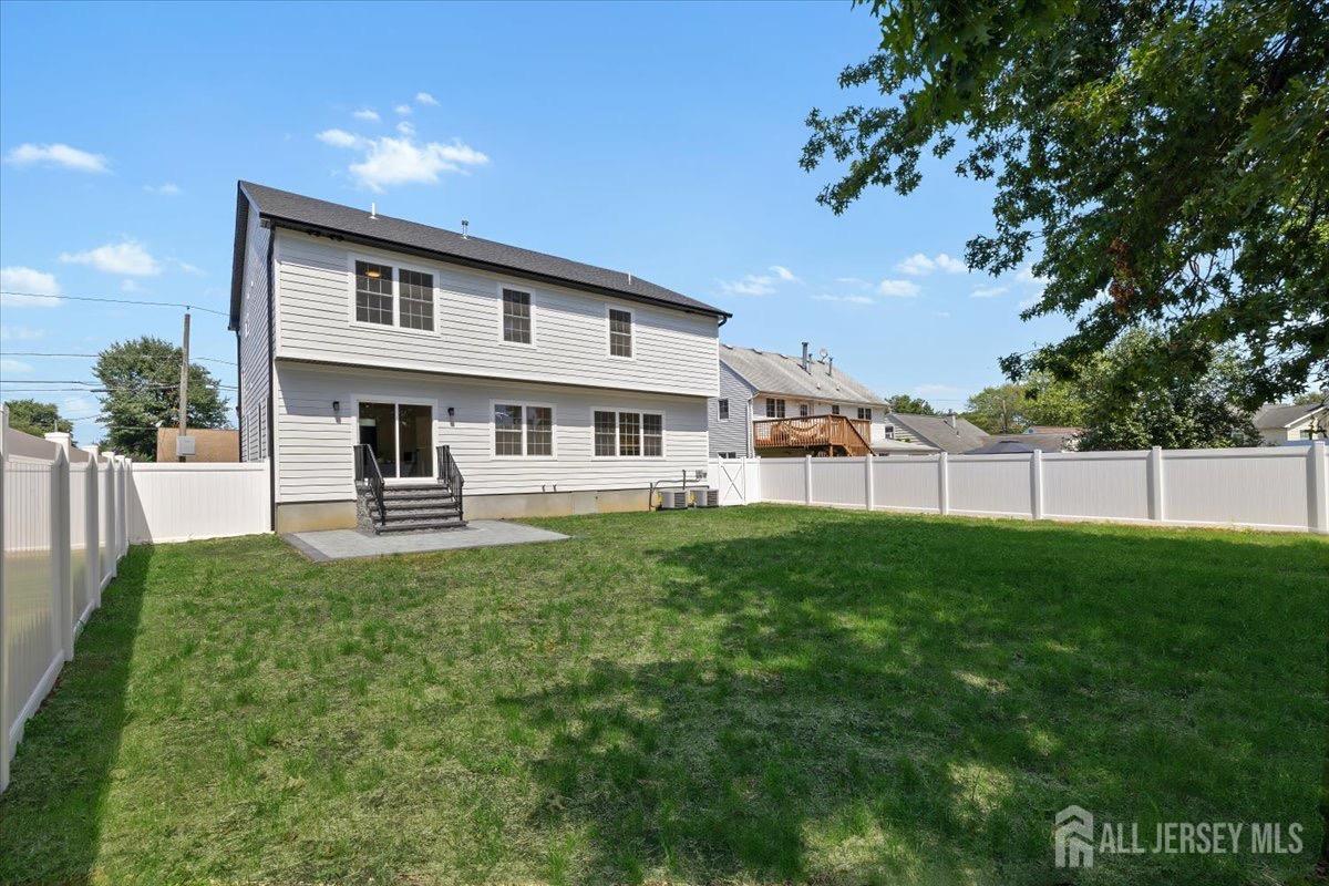 30 Ashley Road Edison, NJ 08817 - Photo 30 of 39 a view of a house with a backyard