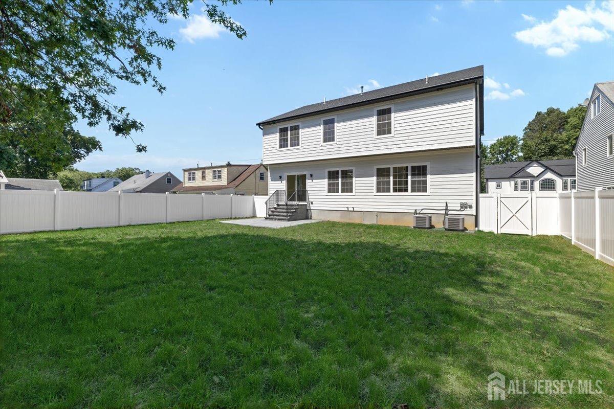 30 Ashley Road Edison, NJ 08817 - Photo 31 of 39 a front view of a house with a yard and trees