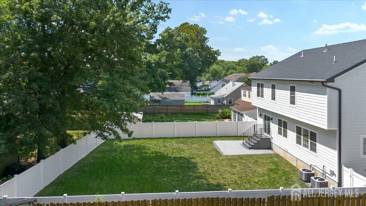 30 Ashley Road Edison, NJ 08817 - Photo 32 of 39 a front view of a house with a yard