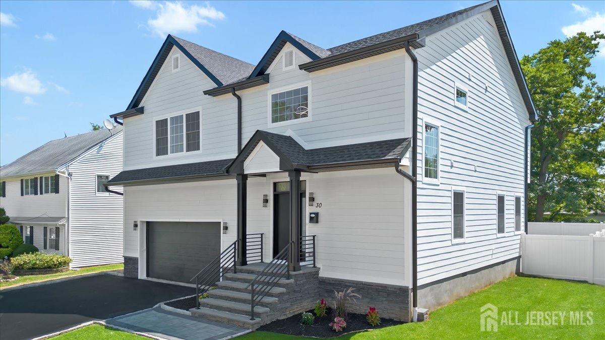 30 Ashley Road Edison, NJ 08817 - Photo 33 of 39 a front view of a house with a yard