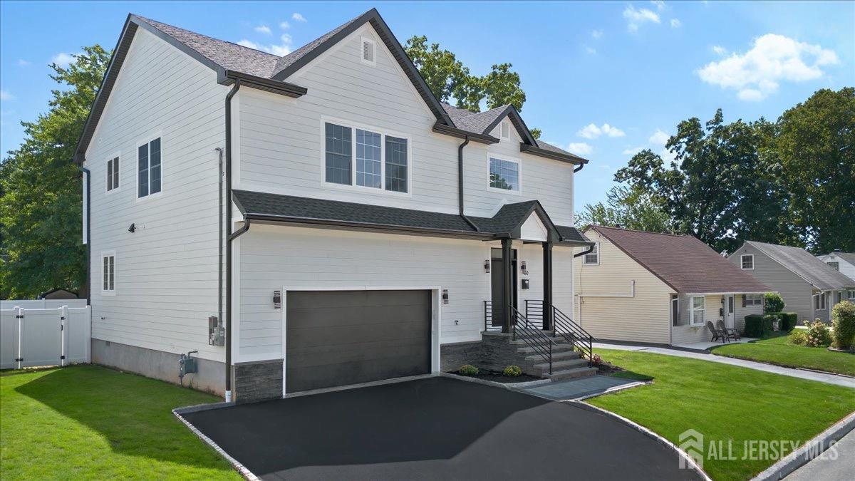 30 Ashley Road Edison, NJ 08817 - Photo 34 of 39 a front view of a house with a yard