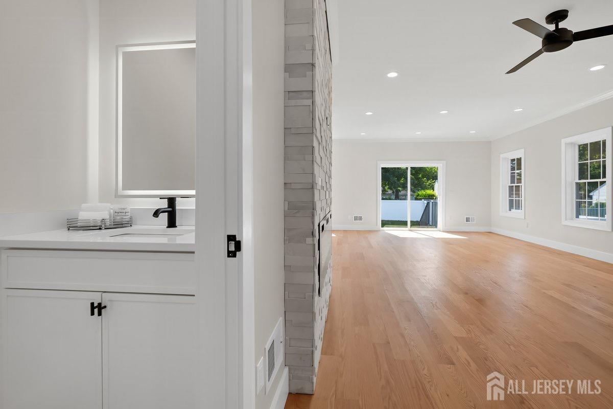 30 Ashley Road Edison, NJ 08817 - Photo 39 of 39 a view of a hallway with wooden floor and a bathroom