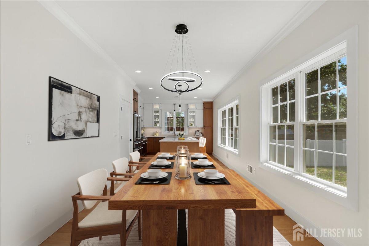 30 Ashley Road Edison, NJ 08817 - Photo 6 of 39 a view of a dining room with furniture window and wooden floor