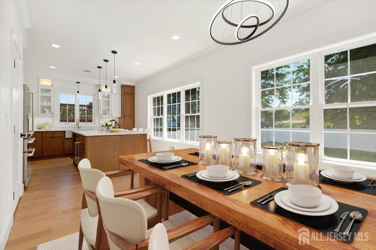 30 Ashley Road Edison, NJ 08817 - Photo 7 of 39 a kitchen with a dining table and chairs