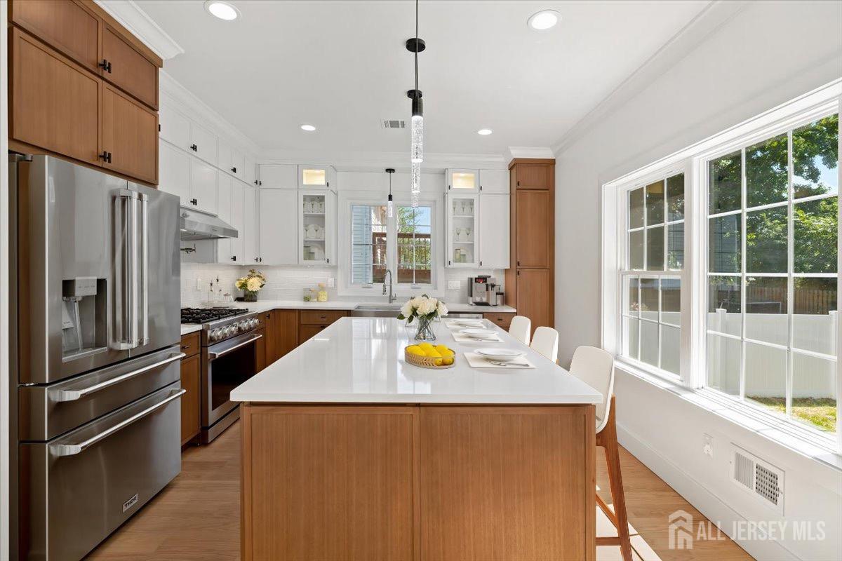 30 Ashley Road Edison, NJ 08817 - Photo 8 of 39 a kitchen with stainless steel appliances granite countertop a refrigerator and a sink