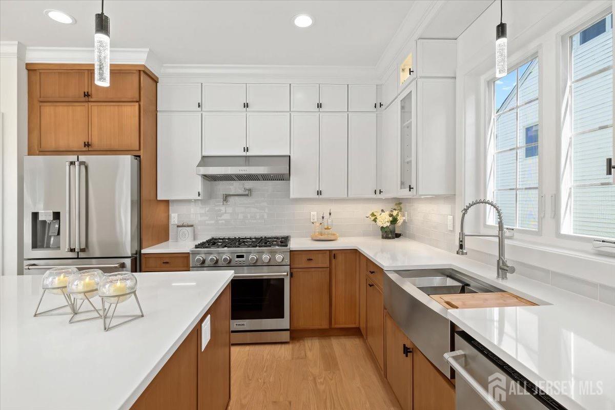 30 Ashley Road Edison, NJ 08817 - Photo 10 of 39 a kitchen with stainless steel appliances granite countertop a sink stove and refrigerator