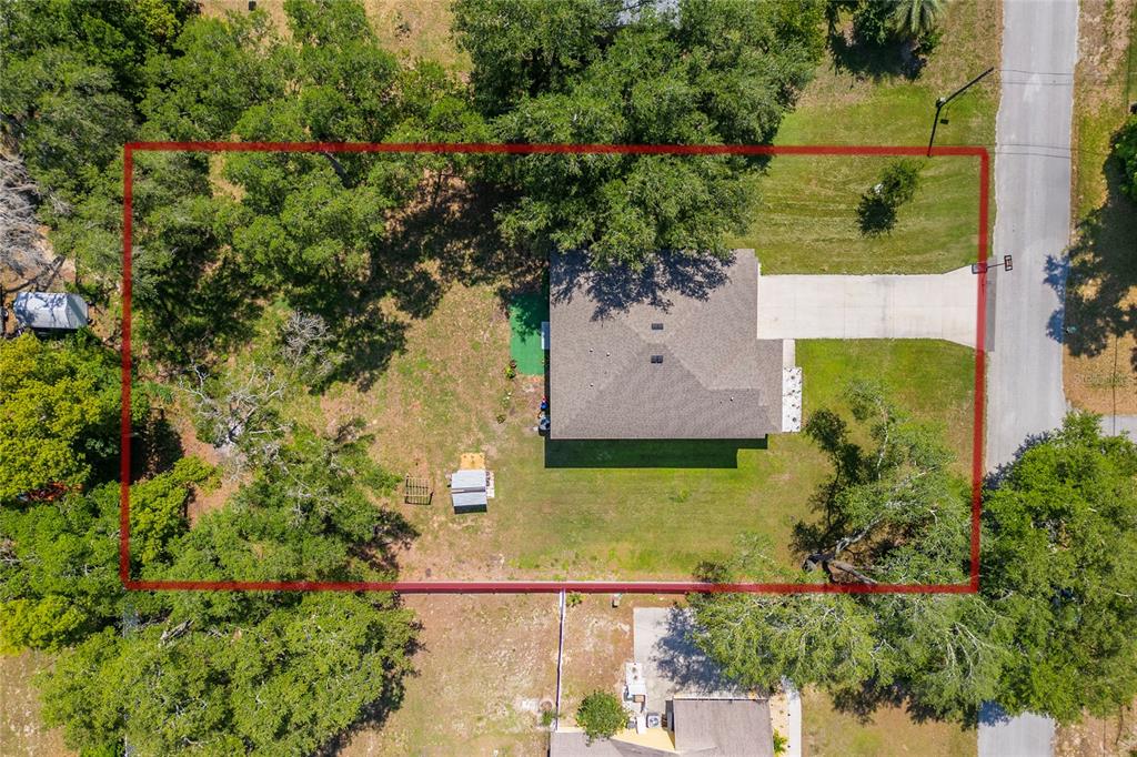 4331 Wayne Road Fruitland Park, FL 34731 - Photo 13 of 46 an aerial view of residential house with outdoor space and trees all around