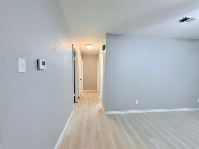 a view of empty room with windows