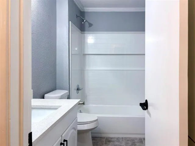 a view of a small space with wooden floor and a window