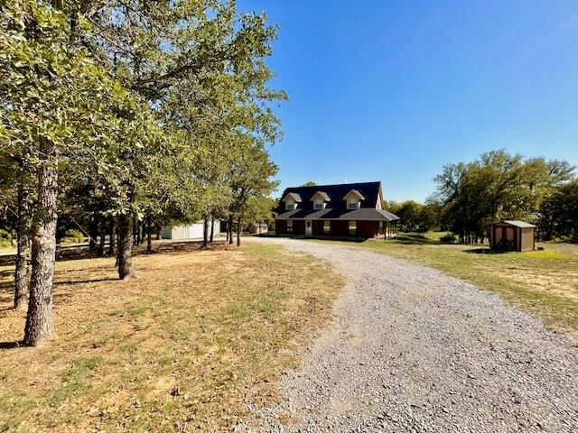 448 Fossil Ridge Road Decatur, TX 76234 - Photo 1 of 1 View of front of property with a storage unit