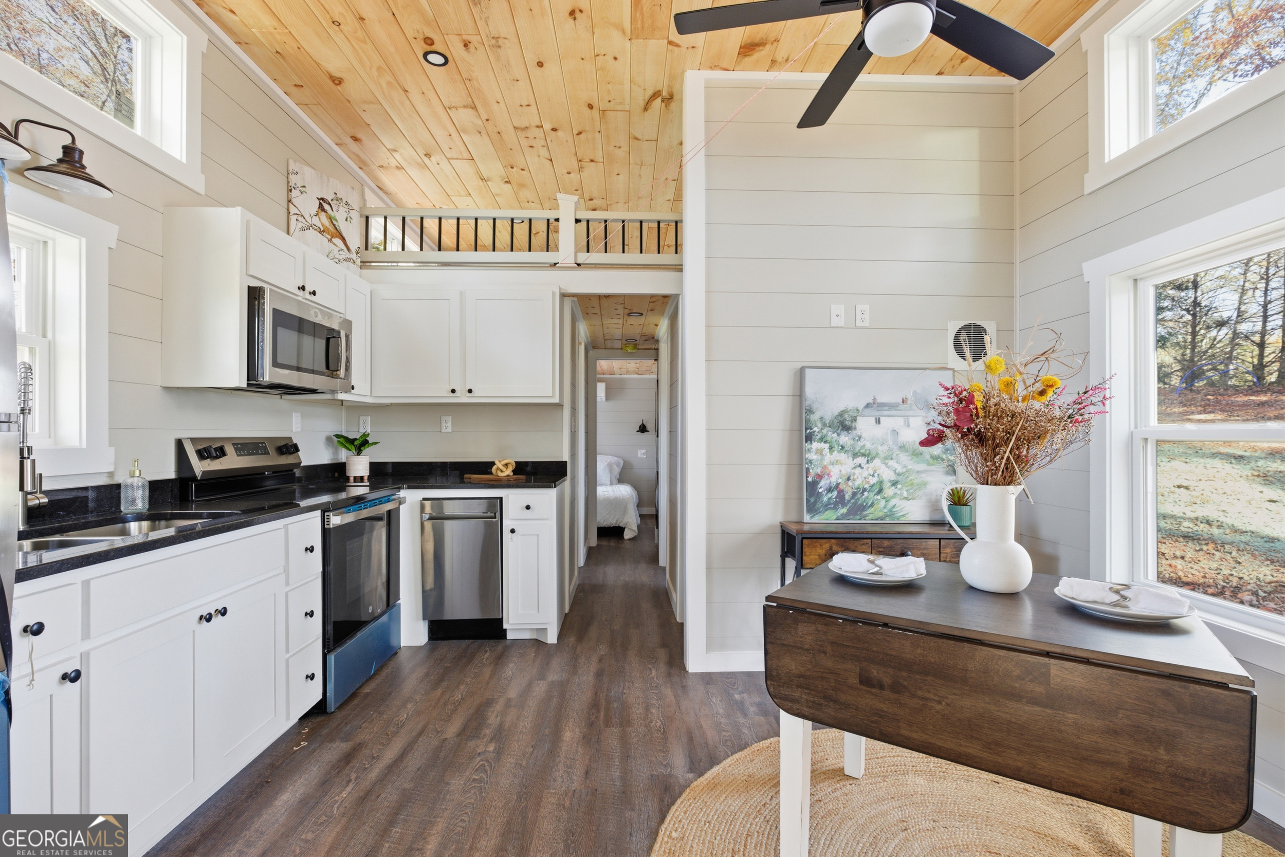 527 Saunders Road Franklin, NC 28734 - Photo 11 of 25 a kitchen with stainless steel appliances kitchen island granite countertop a table and a cabinets