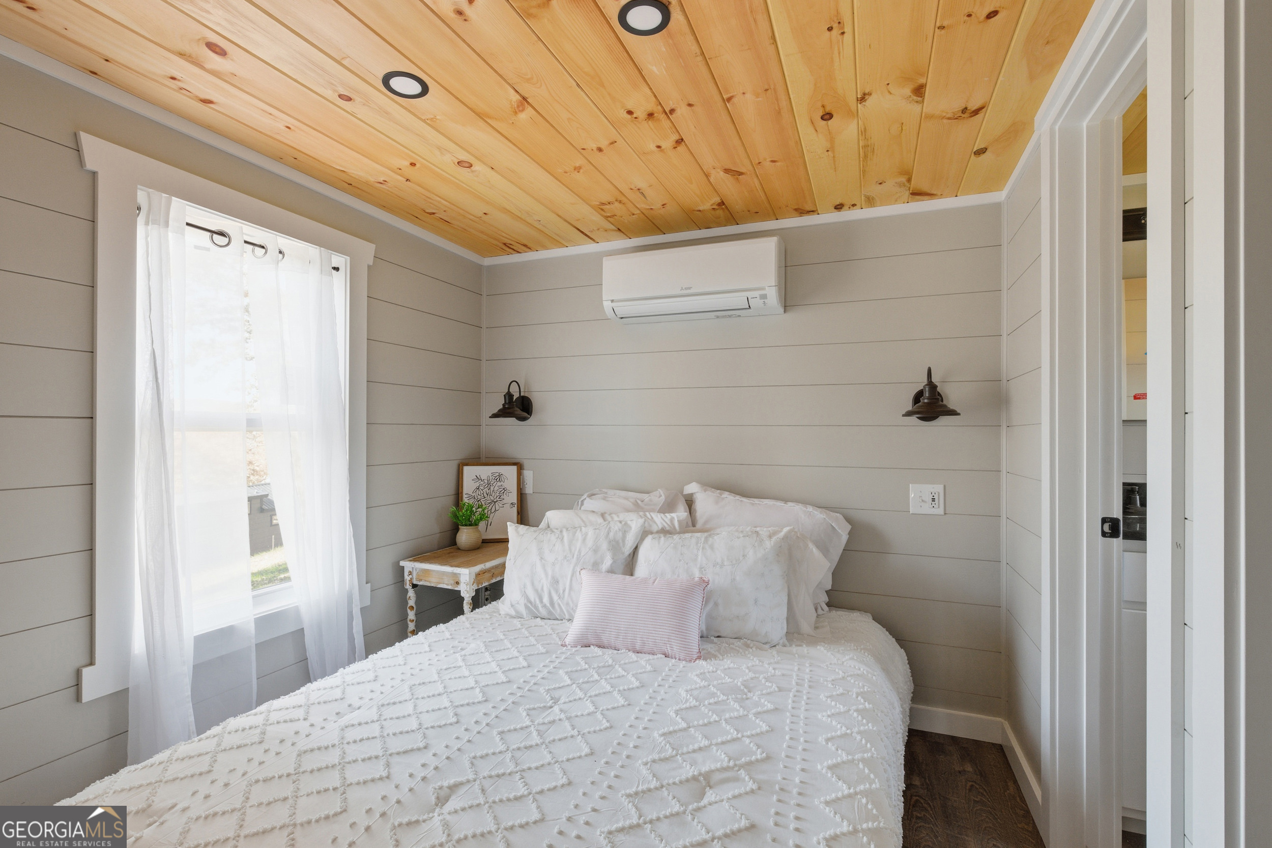 527 Saunders Road Franklin, NC 28734 - Photo 18 of 25 a bedroom with a bed and a window
