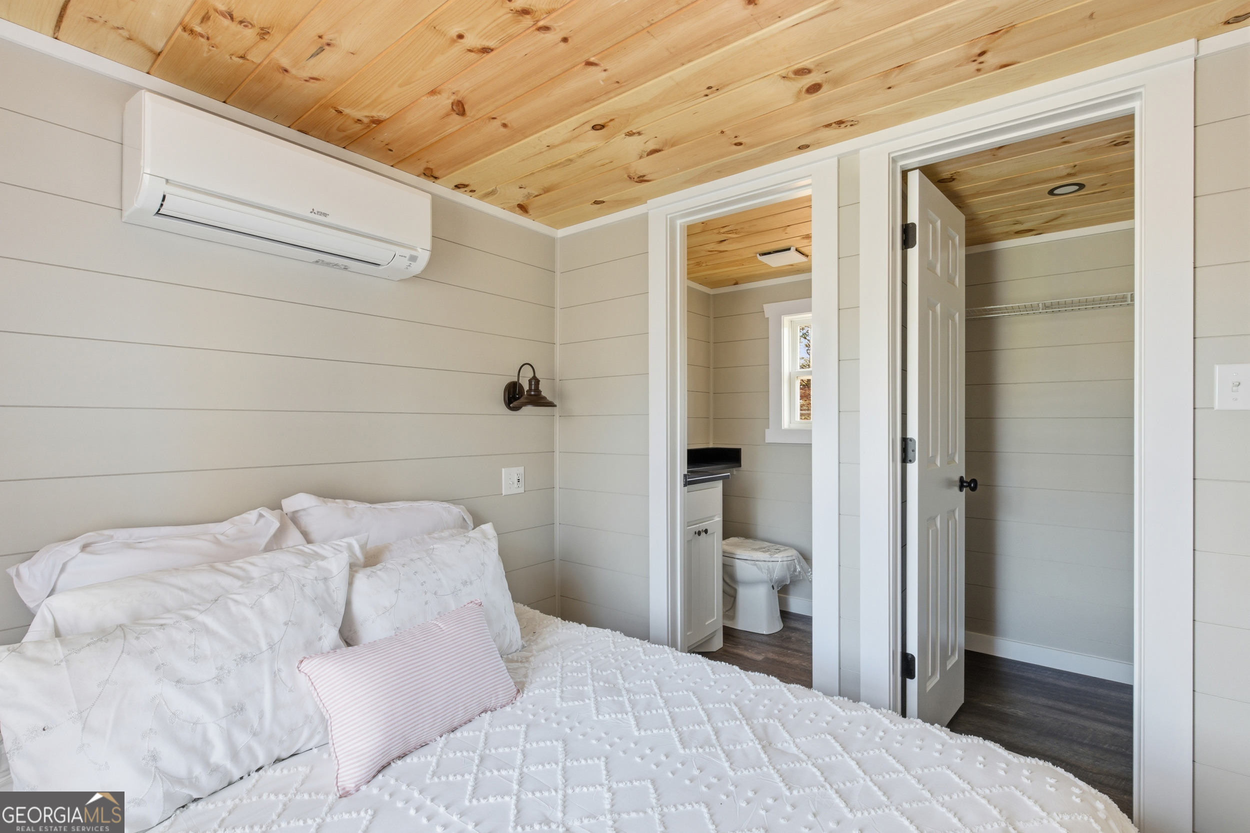 527 Saunders Road Franklin, NC 28734 - Photo 19 of 25 a bedroom with a bed and a view of bathroom