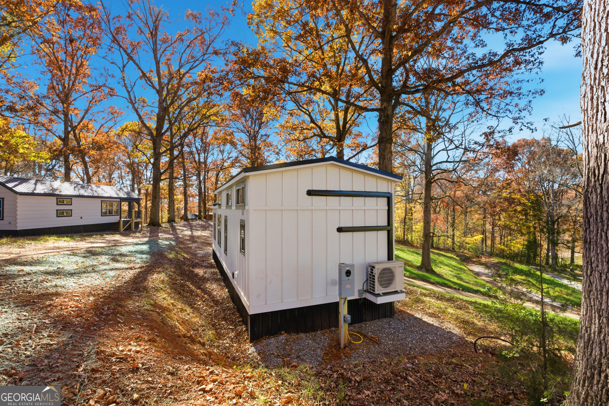 527 Saunders Road Franklin, NC 28734 - Photo 4 of 25 a view of backyard with a large tree and wooden fence