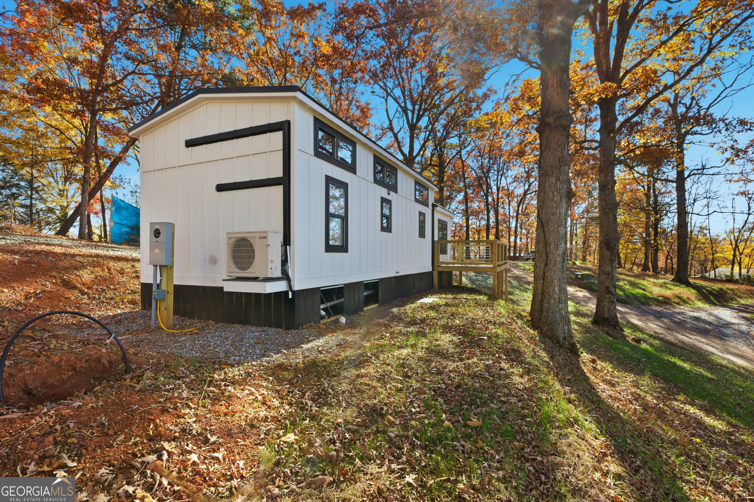 527 Saunders Road Franklin, NC 28734 - Photo 5 of 25 a view of a house with a yard covered in snow