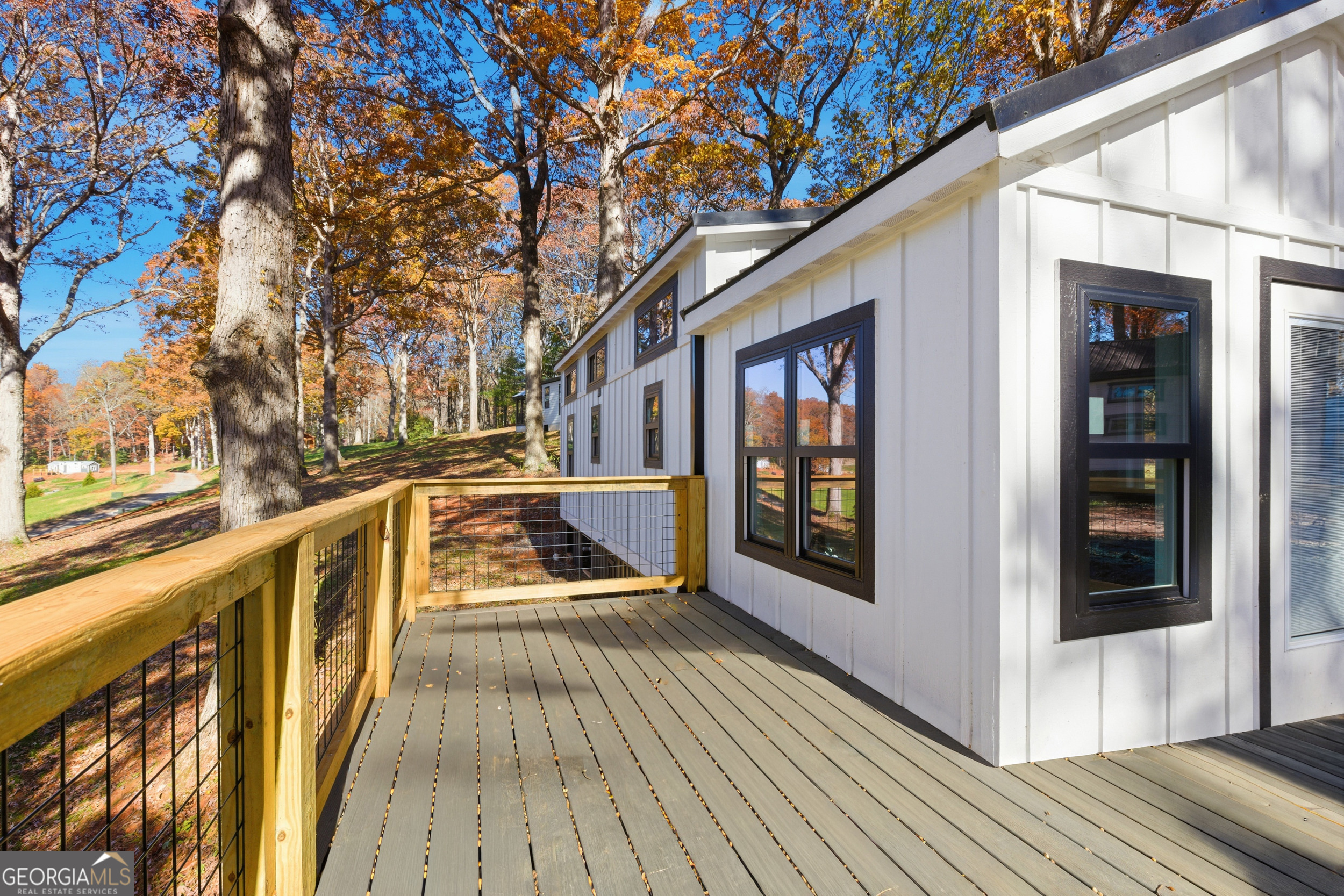527 Saunders Road Franklin, NC 28734 - Photo 6 of 25 a view of balcony with two chairs and wooden floor