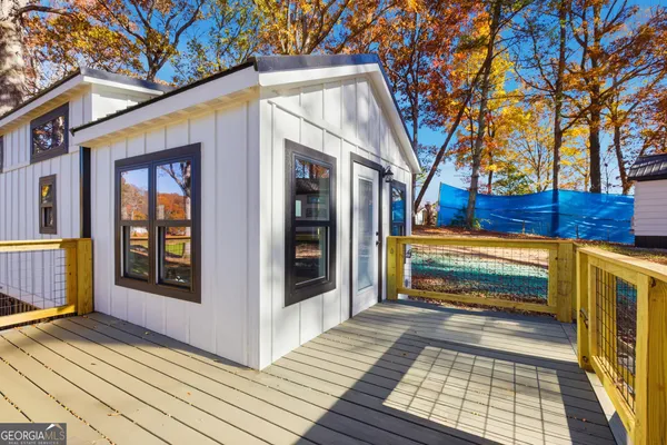 a view of a house with a door and a large window