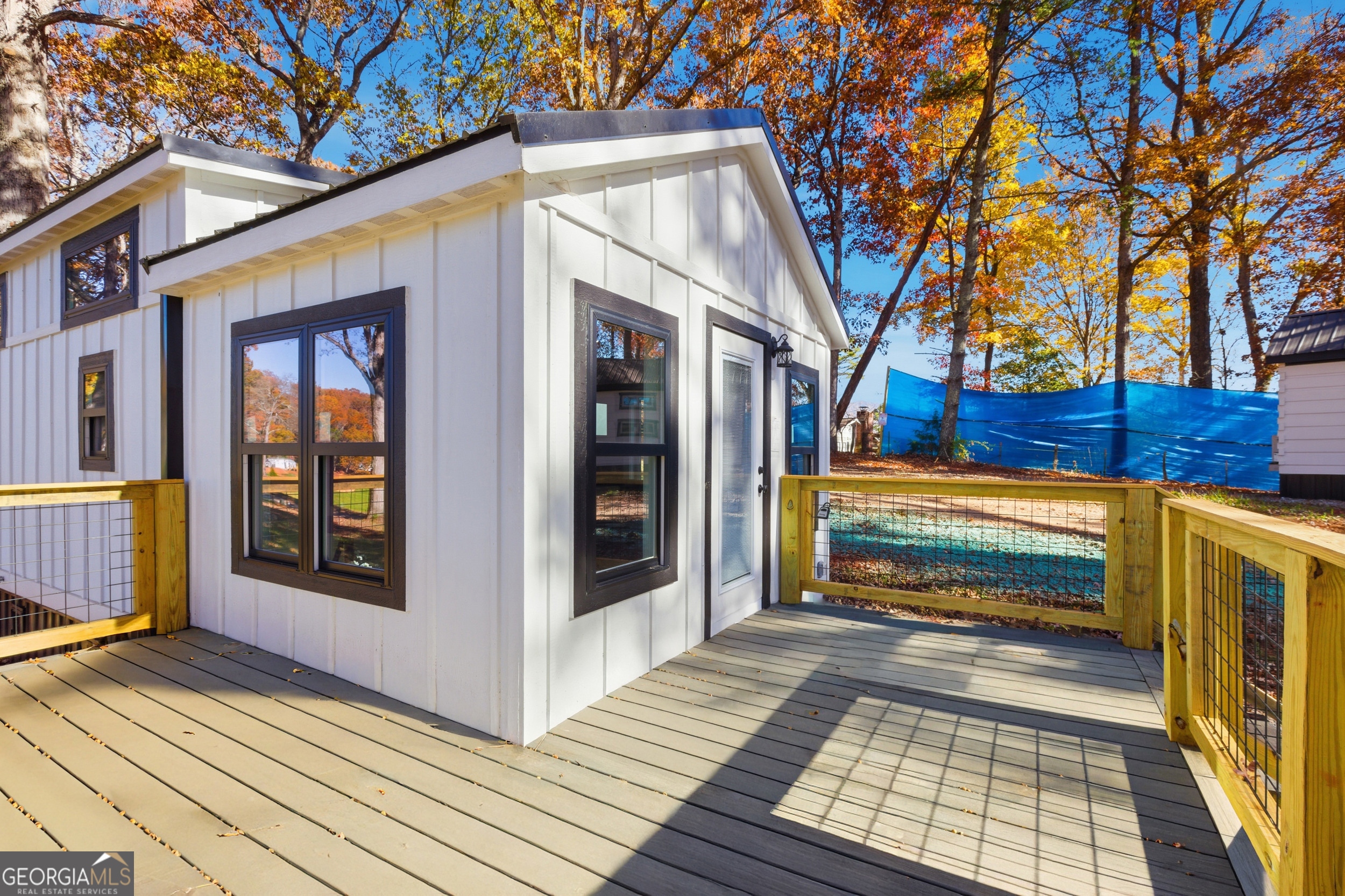 527 Saunders Road Franklin, NC 28734 - Photo 7 of 25 a view of a house with a door and a large window