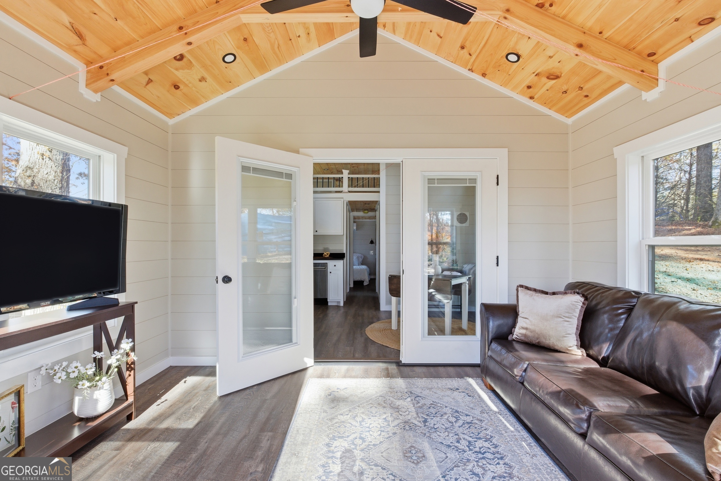 527 Saunders Road Franklin, NC 28734 - Photo 8 of 25 a living room with furniture and a flat screen tv