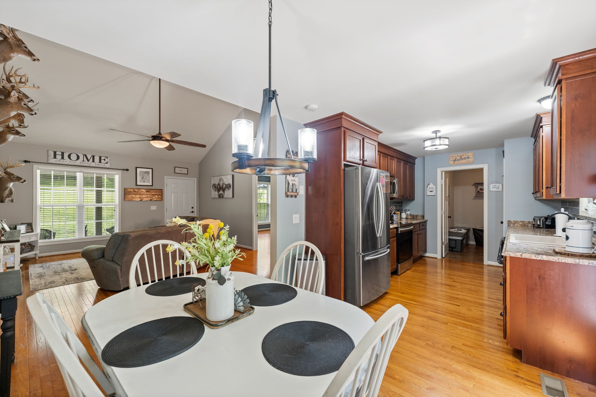 6446 Green Road Springfield, TN 37172 - Photo 8 of 33 a kitchen with stainless steel appliances wooden floor dining table and chairs