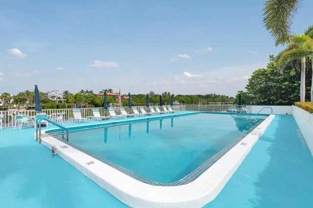 a view of a swimming pool with a terrace