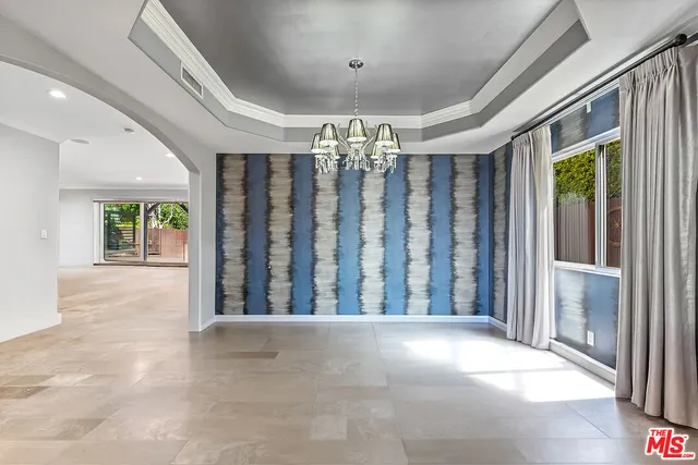 a kitchen with stainless steel appliances granite countertop a sink and a refrigerator