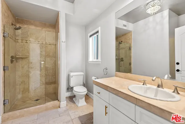 a bathroom with a tub a sink and mirror