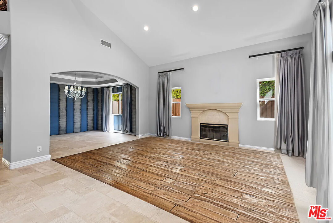 4724 Noble Avenue Sherman Oaks, CA 91403 - Photo 7 of 35 a view of an empty room with window and fireplace
