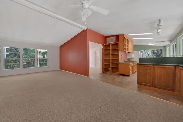 a view of a livingroom with furniture and windows