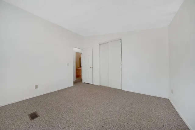 a view of an empty room and entryway