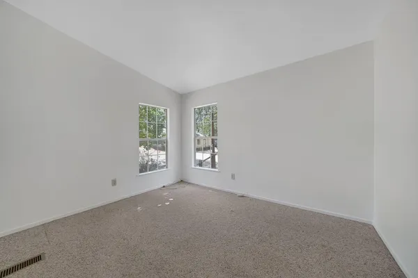 an empty room with windows