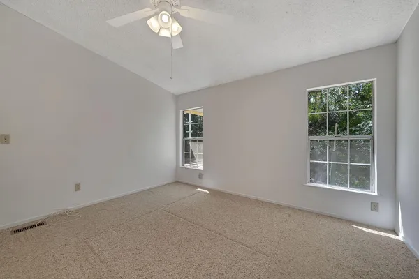 a view of empty room with windows