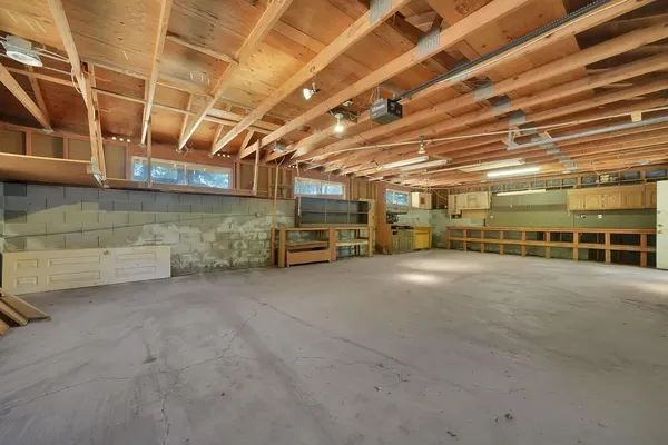 a view of parking garage with a white car
