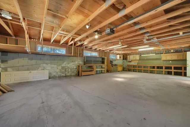 a view of parking garage with a white car