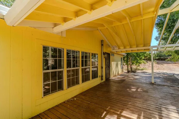 a view of a pathway with a small yard