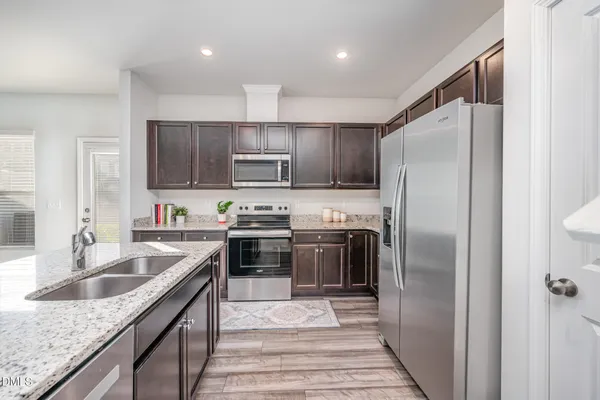 a view of a livingroom with furniture and wooden floor