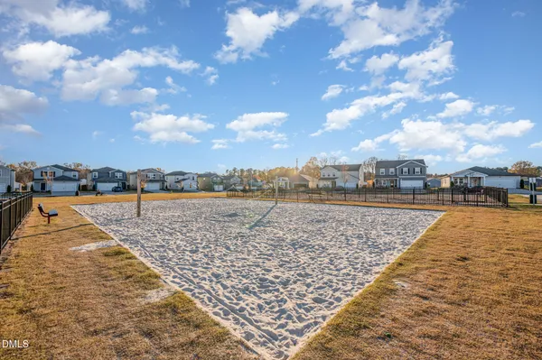 a backyard of a house with yard and outdoor seating