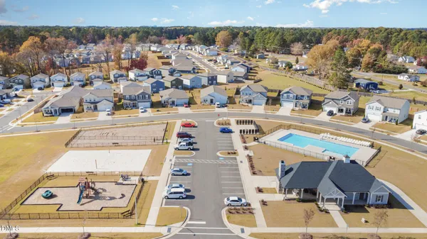 an aerial view of residential houses with outdoor space