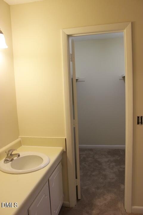 203 East Ransom Street, Unit 3D Fuquay-Varina, NC 27526 - Photo 9 of 10 a bathroom with a sink and a mirror