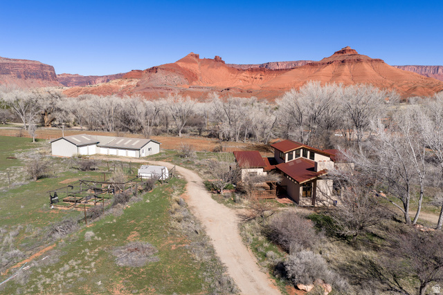 423 Amber Lane Moab, UT 84532 - Photo 7 of 63 Front of home with 4500 sf garage/shop in background