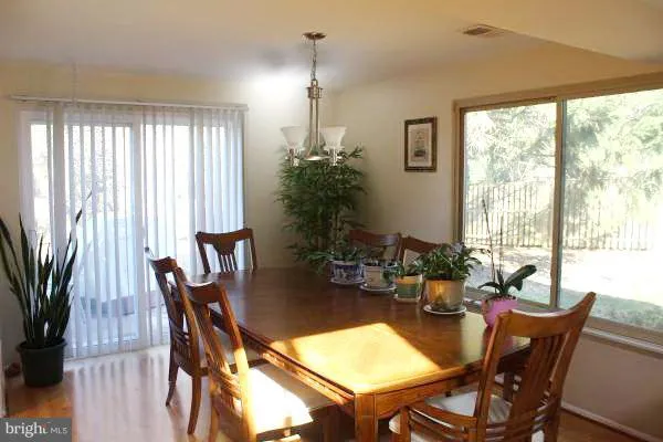 a view of a dining room with furniture and window