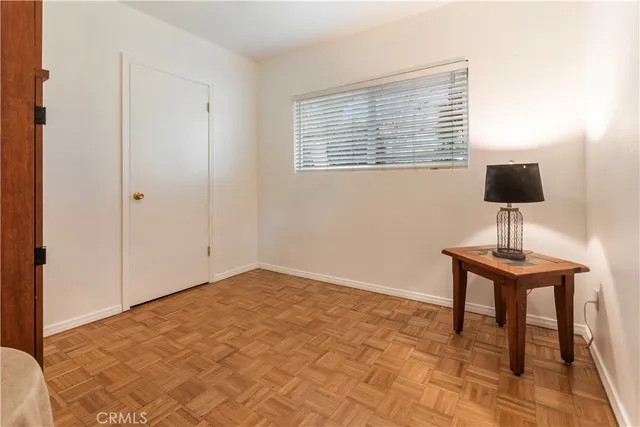 a view of room a flat screen tv and a window