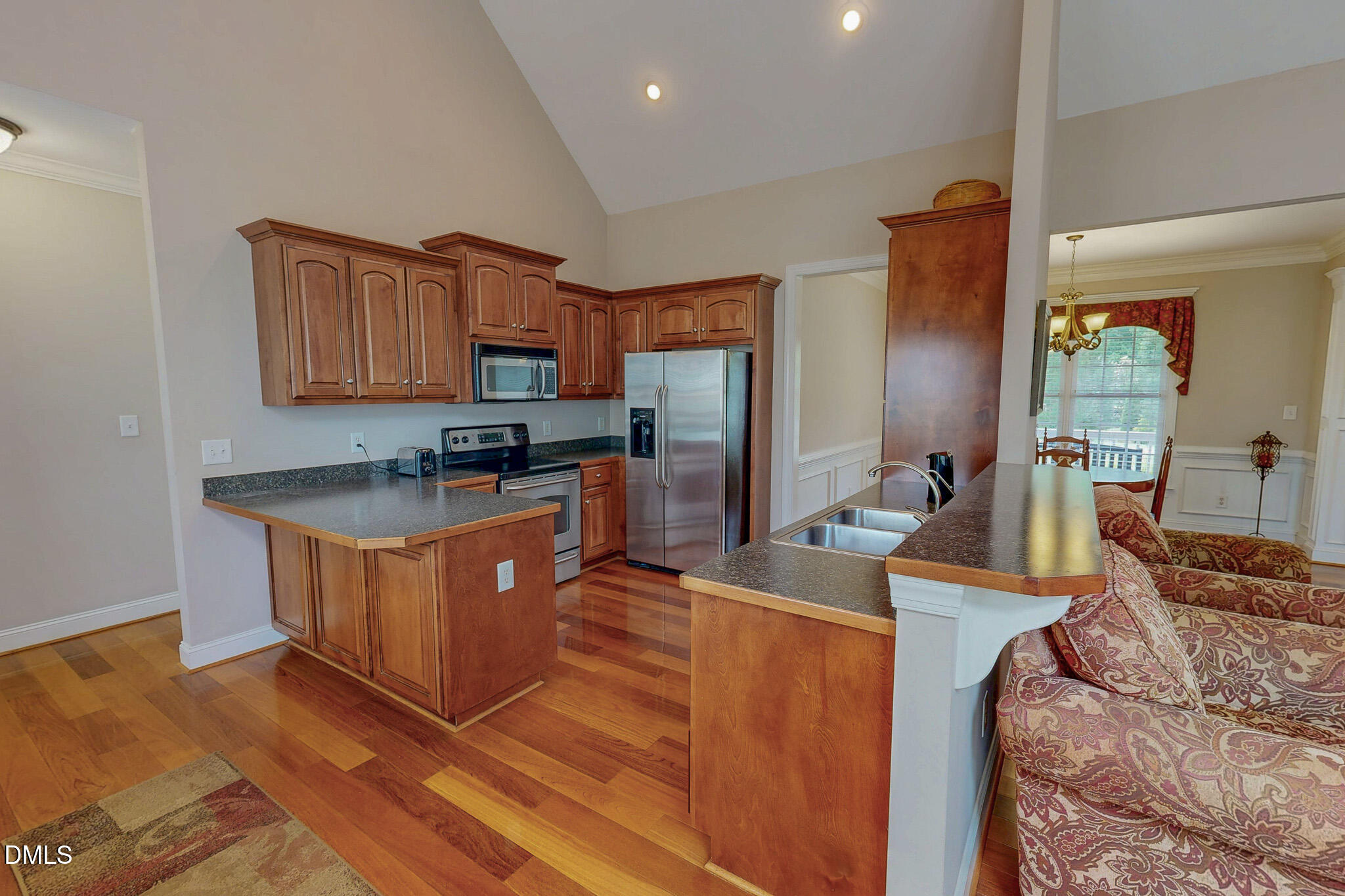 115 Duncan Plantation Road Timberlake, NC 27583 - Photo 9 of 48 a large kitchen with stainless steel appliances granite countertop a stove a sink a refrigerator and a granite counter tops with a large window