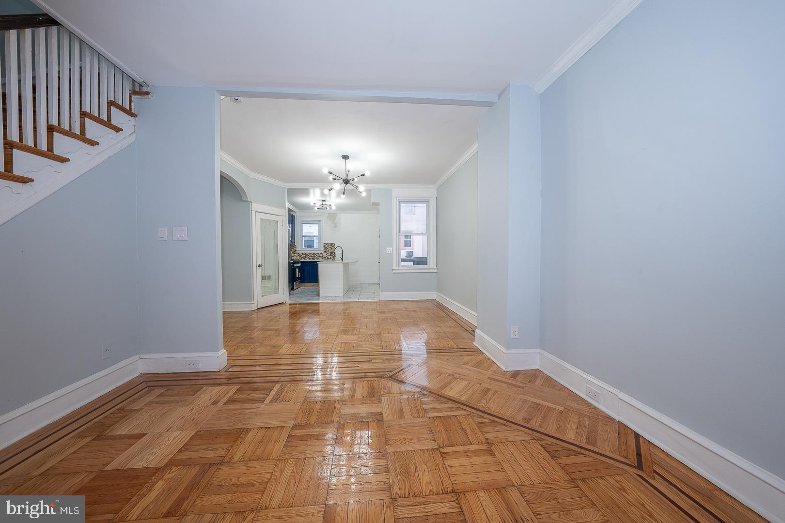 212 Copley Road Upper Darby, PA 19082 - Photo 12 of 69 a view of a hallway with a chandelier